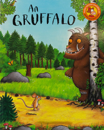 Book Cover- An Gruffalo. Illustrated image of a hairy beast and a mouse in the forest. 