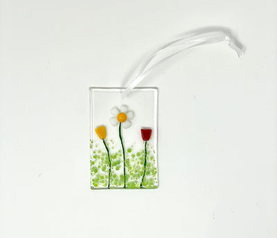 Fused glass ornament. Daisy and tulips.