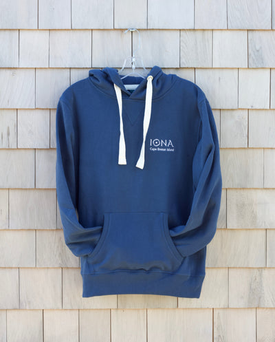 Blue Coloured Hoody with white drawstrings. Embroidered logo which says 'Iona Cape Breton Island'